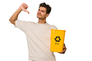 Young caucasian man holding a metal trash for recycle Young caucasian man holding recycling bins...