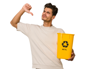 Young caucasian man holding a metal trash for recycle Young caucasian man holding recycling bins isolated on white background feels proud and self confident, example to follow.