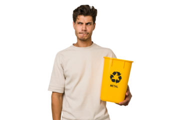 Young caucasian man holding a metal trash for recycle Young caucasian man holding recycling bins isolated on white background confused, feels doubtful and unsure.