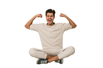 Young caucasian man sitting on the floor isolated on white background showing strength gesture with arms, symbol of feminine power