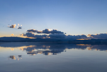 The reflection of the sunrise at Erhai Lake in Dali, Yunnan