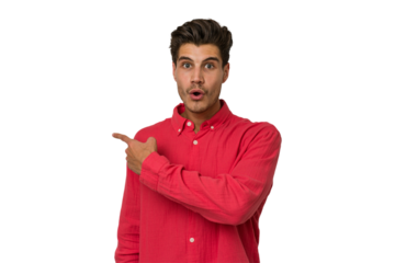 Young handsome caucasian man isolated on white background smiling and pointing aside, showing something at blank space.