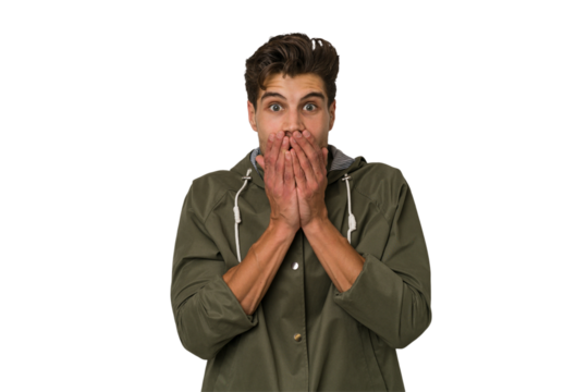 Young handsome caucasian man isolated on white background shocked, covering mouth with hands, anxious to discover something new.