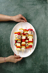 various fresh vegetables on wooden skewers, vegan bbq preparation, vegetarian food, eating out