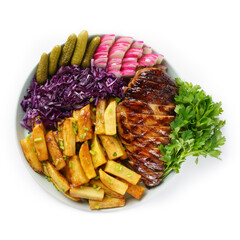 juicy barbecue steak with fried potatoes in a restaurant, served with beer, fresh vegetables and pickles, ketchup and mayonnaise