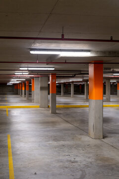 Empty commercial car park lanes and pylons.