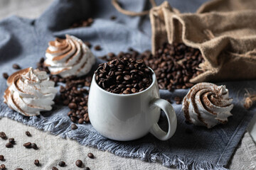 Freshly Brewed Espresso with Meringues and Coffee Beans