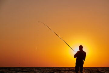 Fisherman Casting at Sunset