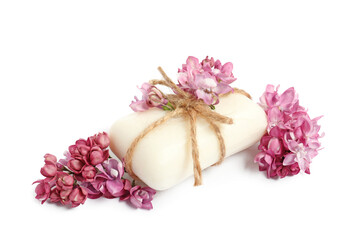Soap bar and lilac flowers isolated white