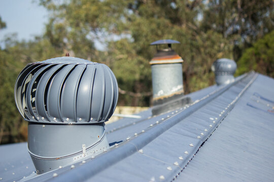 Whirlybird roof vents on tin roof