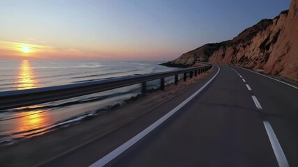 POV video of car driving forward on coastal road at sunset with ocean view and cliffs, scenic highway journey, ideal for travel, freedom, and summer road trip content