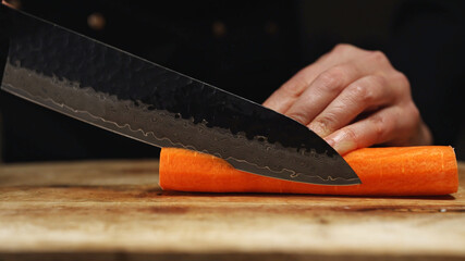 Female Chef Slicing Carrots into Julienne Strips.