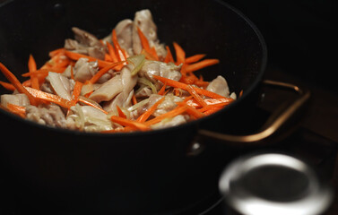 Frying Chicken and Carrots for Pilaf Preparation.