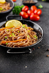 Buckwheat noodles soba in a bowl fresh dish Asian cuisine on the table rustic food top view copy space
