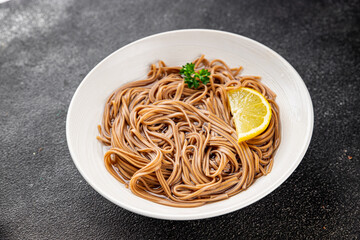 Buckwheat noodles soba in a bowl fresh dish Asian cuisine on the table rustic food top view copy space