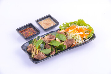 Boiled pork with dip in the black dish.