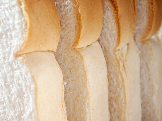 Close-up of freshly sliced ​​soft and fragrant bread with white bread,brown bread crust macro