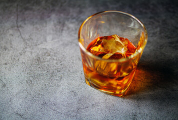 Strong alcohol drink. Whisky in glass with ice, Whisky, bourbon or cognac. Hard strong alcoholic drink