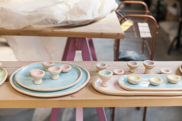 Hand-painted ceramic Easter eggs and holders with wildflowers. Natural tones and minimalist design. Springtime table decor, handmade with care in a ceramic workshop