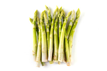 Raw fresh organic asparagus stems on white background, bunch of homegrown green asparagus ready for cooking food. Summer harvest, healthy cooking ingredient