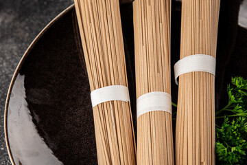 Buckwheat noodles raw soba fresh dish natural food Asian cuisine on the table rustic food top view copy space