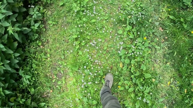 close up of the foot and shoes of backpacker walking on Combe, Kintbury, Berkshire, England.