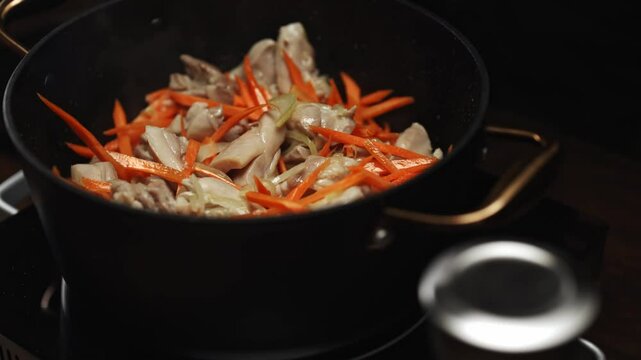 Frying Chicken and Carrots for Pilaf Preparation.