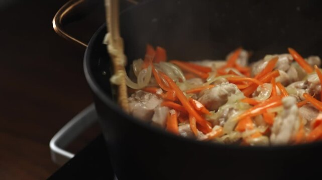 Frying Chicken and Carrots for Pilaf Preparation.