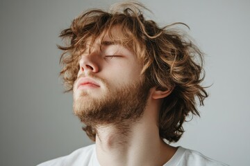 Obraz premium Young man with dry shaggy damaged hair looking sad