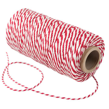A close-up of red and white bakers twine on a brown cardboard spool PNG file isolated on transparent background cut out, clipping path, social media, Advertisement, HD photo, close up, high quality.