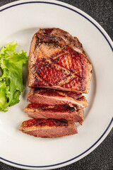 Duck breast roast meat poultry fresh delicious gourmet food background on the table rustic food top view copy space