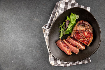 Duck breast roast meat poultry fresh delicious gourmet food background on the table rustic food top view copy space