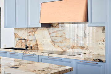 Elegant Kitchen Design Showcasing Stunning Marble Features and Beautiful Blue Cabinets