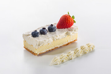 Fresh Strawberry and Blueberry Cream Cheesecake Bar with Piped Cream Garnish