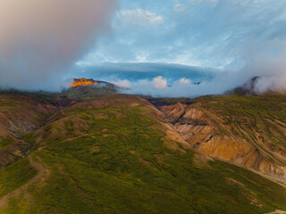 Fototapeta premium Colorful hills and misty peaks of Brunnadalir valley, East Iceland at sunset...