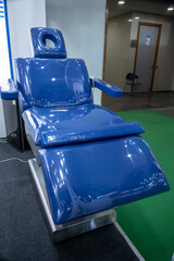 The blue glazed dental chair is designed for patient comfort during dental procedures, enhancing patient experience.