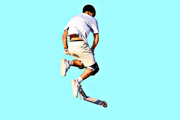 Young man practicing Scootering (Freestyle Scootering) on ​​a turquoise background