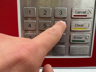 dial the code digits on the ATM