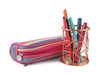 Different stationery in pencil case and pen holder isolated on white