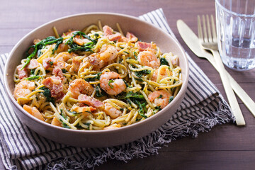 Prawn and bacon pasta with spinach. Spaghetti