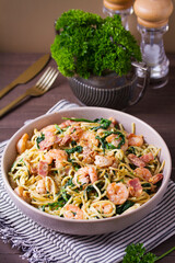Prawn and bacon pasta with spinach. Spaghetti