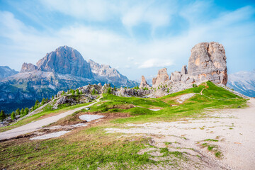 Majestic landscape of Alpine Cinque Torri in background Passo Falzarego, Tofana. Hiking nature scenery in Dolomite, Italy near Cortina d'Ampezzo