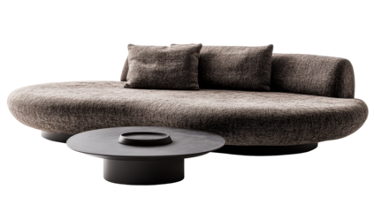 Plush, pebble-shaped sofa with two cushions and a low, dark circular coffee table on short legs