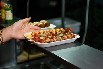Delicious Street Food Skewers and Fries Served in Styrofoam Tray