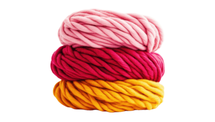 Three balls of chunky yarn stacked, showcasing shades of pink, crimson, and gold