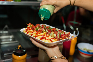 Delicious Street Food Skewers and Fries Served in Styrofoam Tray