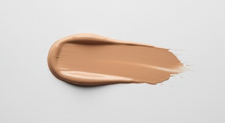 Fototapeta premium Beige foundation smear or liquid tone makeup stroke swatch.Swatch of cosmetic foundation on a white background. Beauty product for makeup application. Skincare and beauty concept.