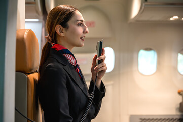 Friendly Caucasian female flight attendant in airline uniform announcing on board , airline...
