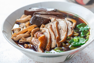 Delicious chinese noodle soup local market food cozy setting close-up shot culinary delight