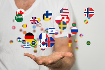 Image of a hand gently holding various national flags, symbolizing international collaboration and...